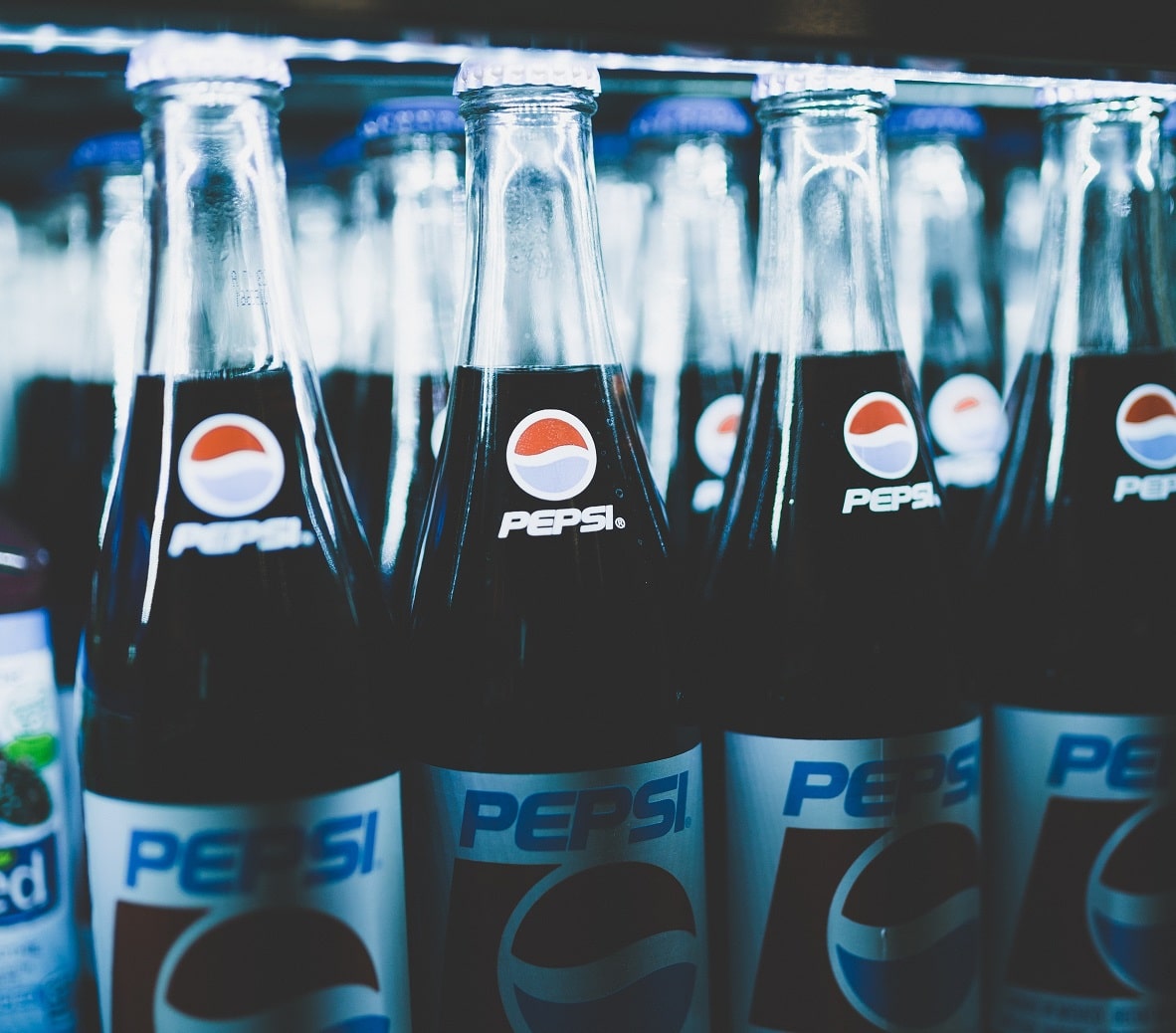 Glass bottles of Pepsi in the fridge